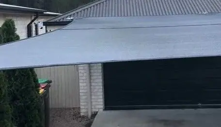 Architectural carport shade sail in Burpengary East providing stylish vehicle protection and lasting performance.