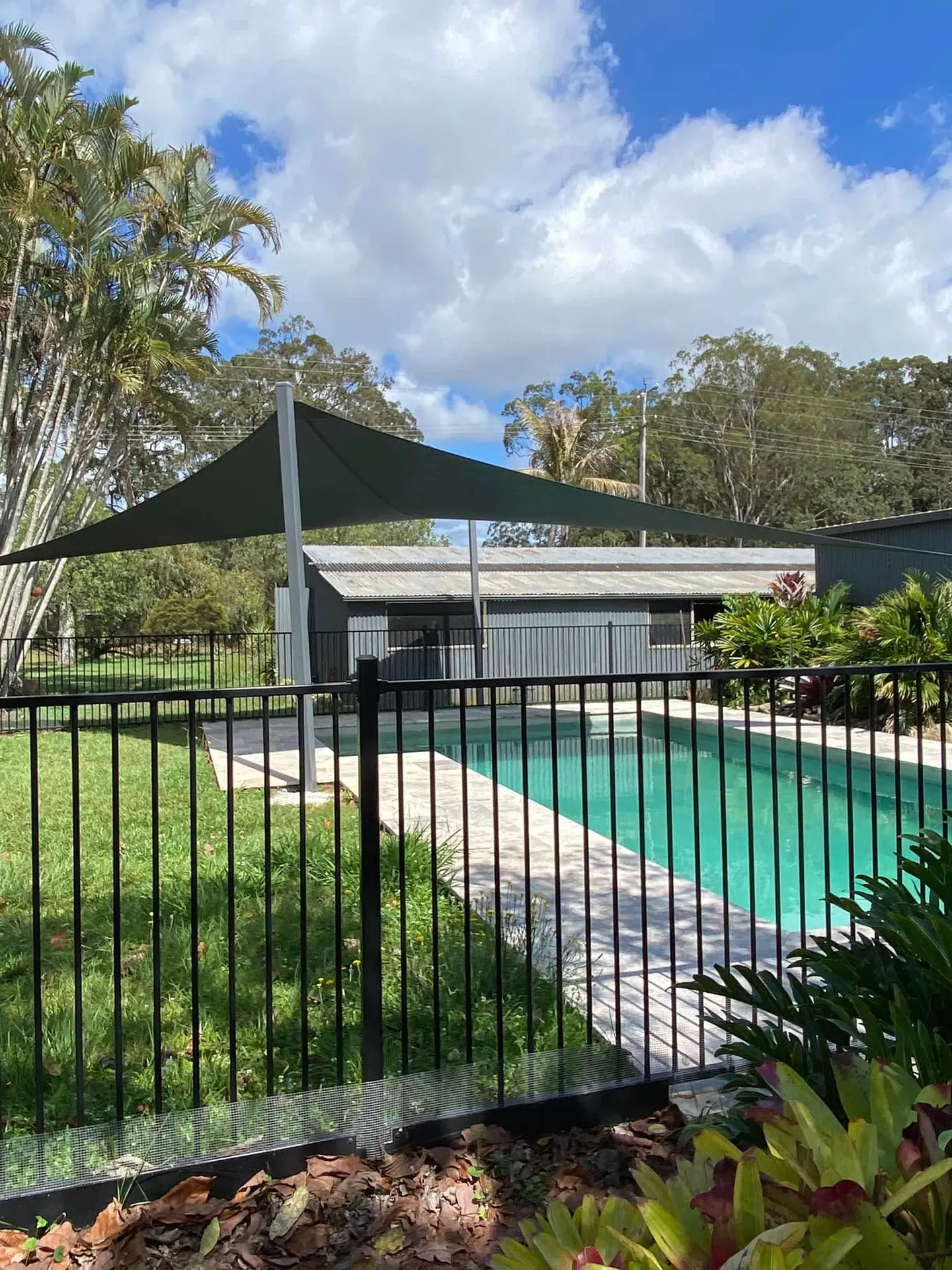 Pool shade sail installation, original photograph 3